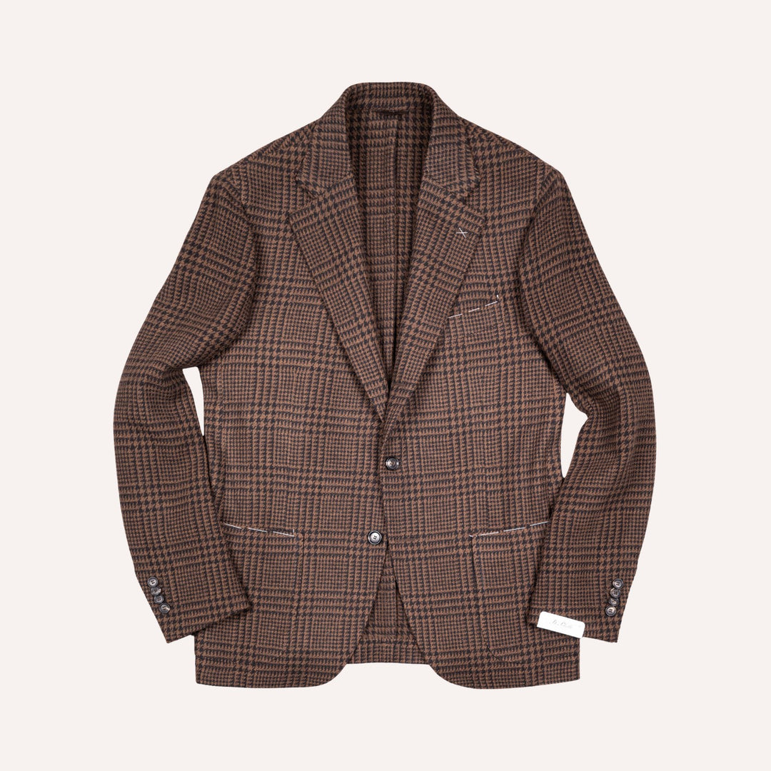 A brown and beige plaid blazer jacket with a subtle checkered pattern, shown flat against a light cream background.
