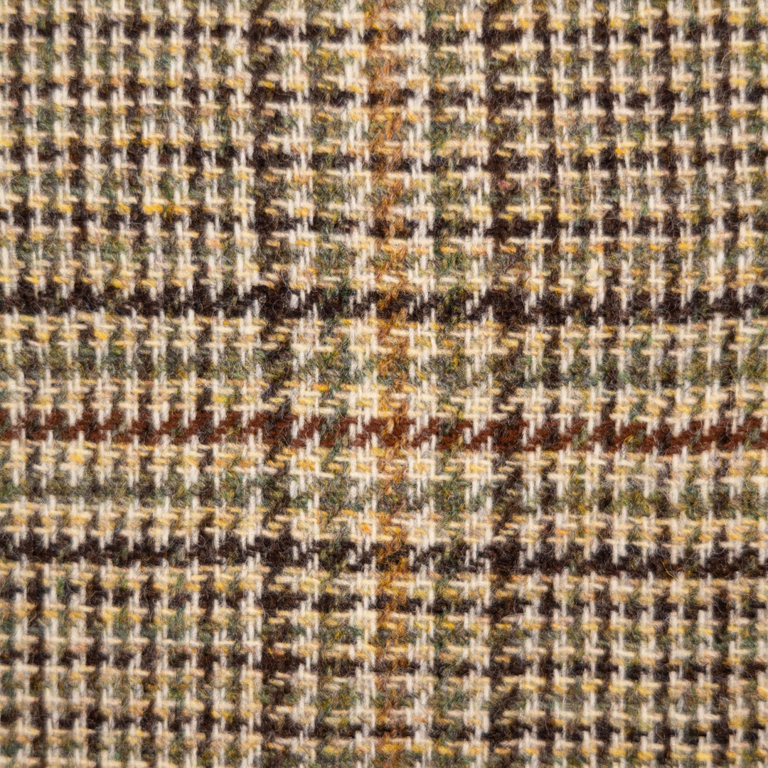A close-up of a textured woven fabric with a houndstooth and plaid pattern in beige, brown, olive green, and dark brown.
