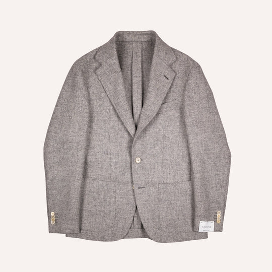 A light gray textured wool blazer with a two-button front, notched lapels, and cream button accents on the cuffs, displayed flat against a light cream background.