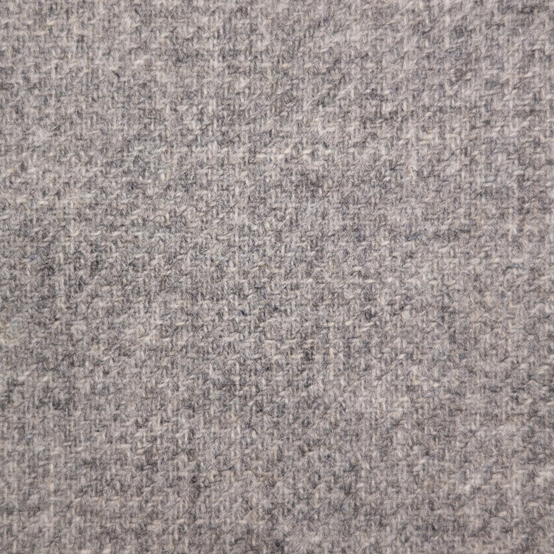 A close-up texture shot of a heathered gray fabric, showing a woven pattern of light and dark gray threads.