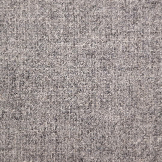 A close-up texture shot of a heathered gray fabric, showing a woven pattern of light and dark gray threads.