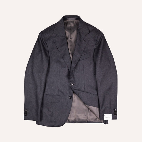 A dark charcoal gray textured wool blazer jacket with a satin lining, shown flat against a light cream background.