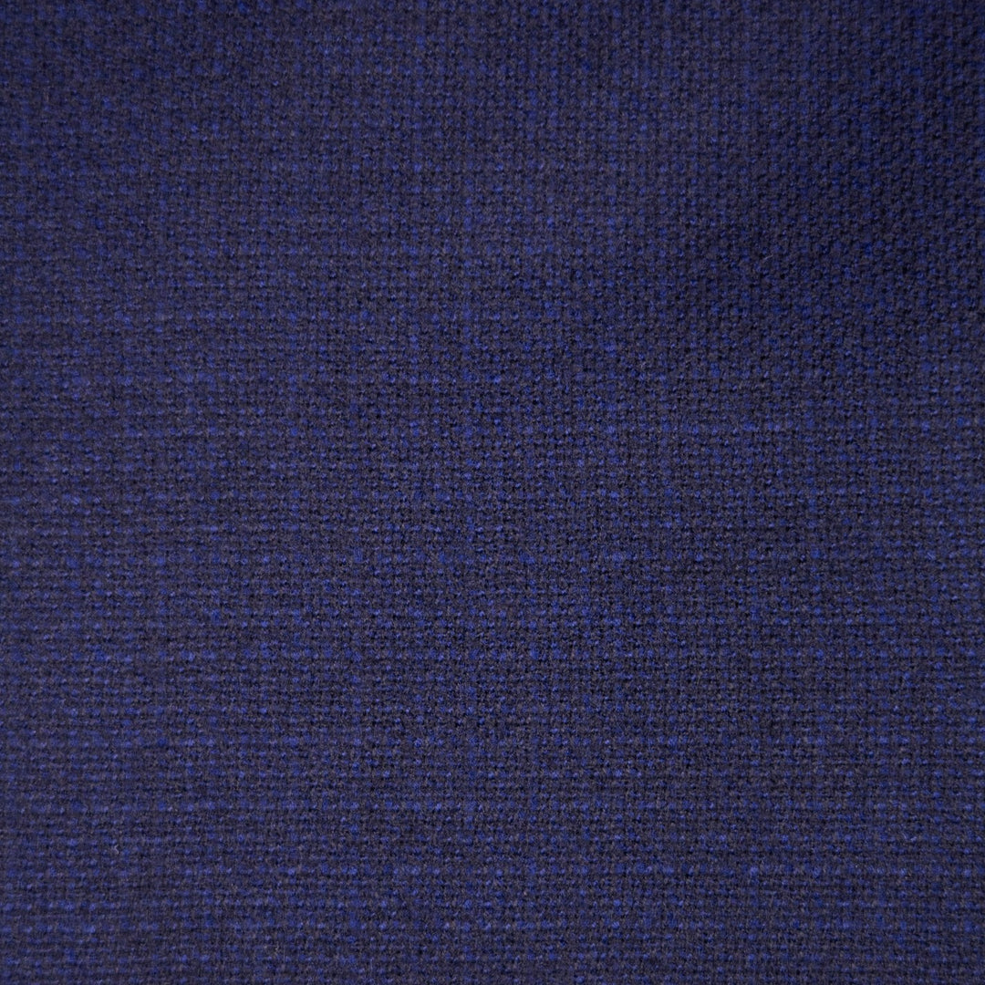 A close-up of a dark navy blue textured fabric with a fine woven pattern.