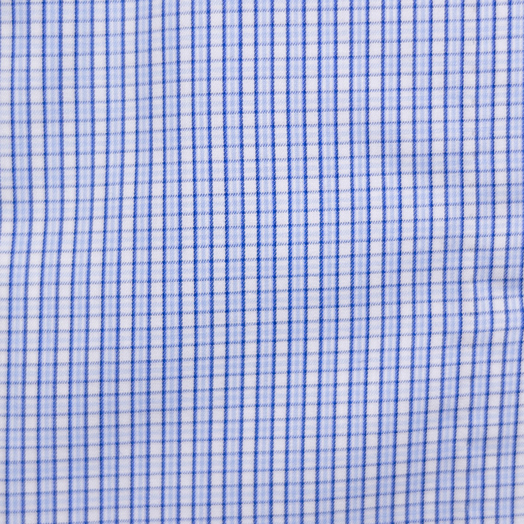 A close-up of a white fabric with a fine blue gingham check pattern.