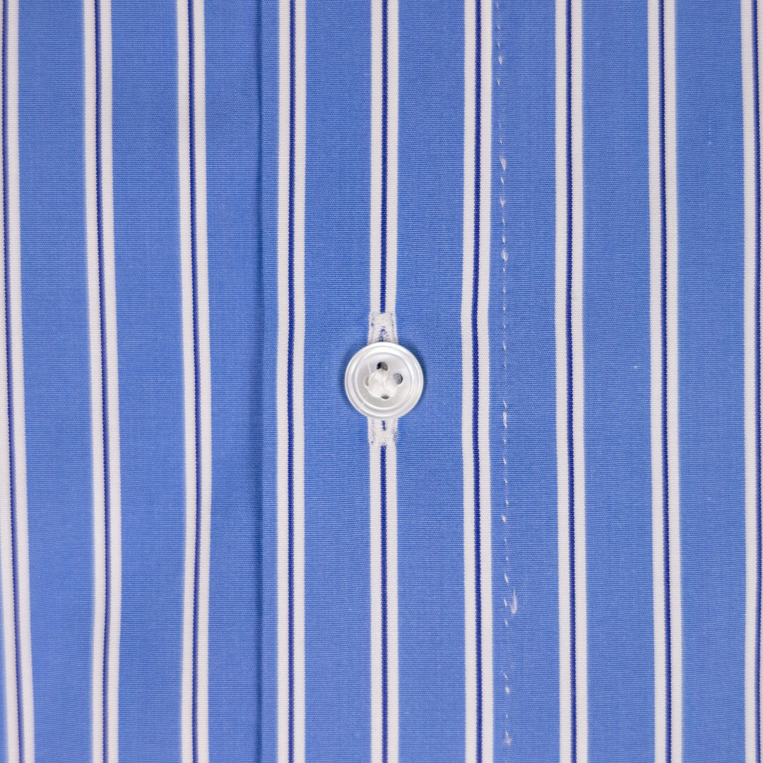 Close-up of a blue and white vertically striped shirt fabric with a white button at the center.