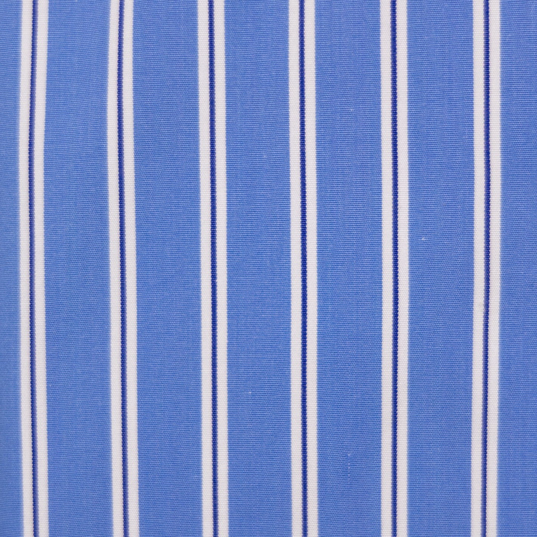 A close-up of a blue woven fabric with vertical white and thin dark navy stripes.