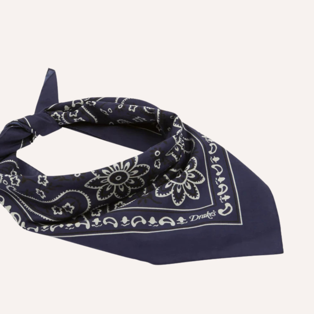 Navy blue bandana with white patterns on a white background