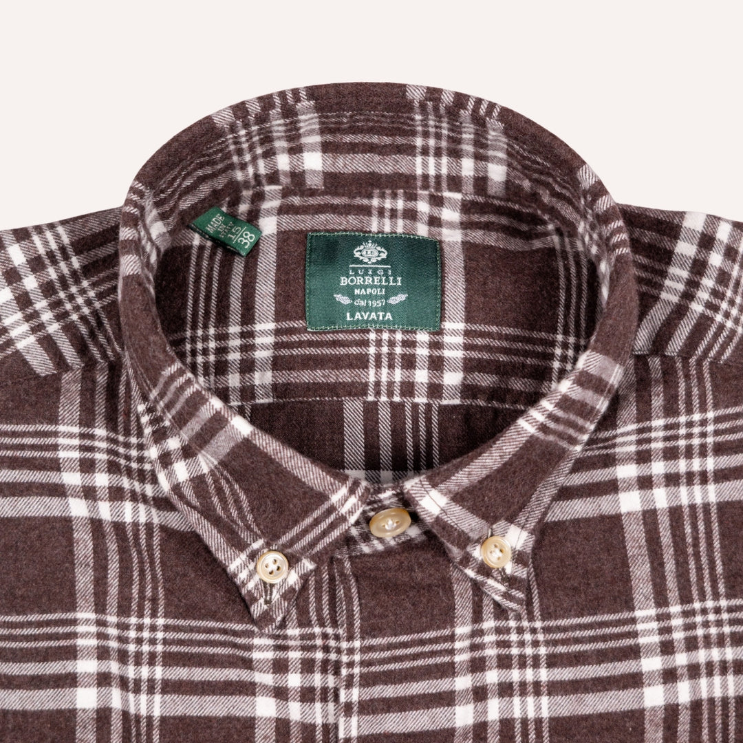 Close-up of a brown and white plaid button-down shirt collar with a green BOBBELLI brand label inside the neck.