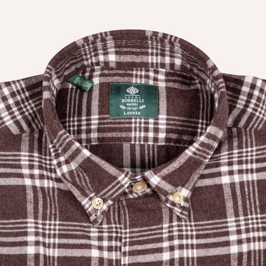 Close-up of a brown and white plaid button-down shirt collar with a green BOBBELLI brand label inside the neck.